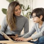 Kerala parent and child reviewing CBSE online tuition options together on a laptop