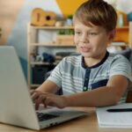 CBSE student in Kerala attending an online tuition class on a laptop at home