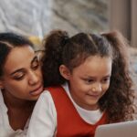 Kerala parent and CBSE student reviewing online tuition together on a laptop at home