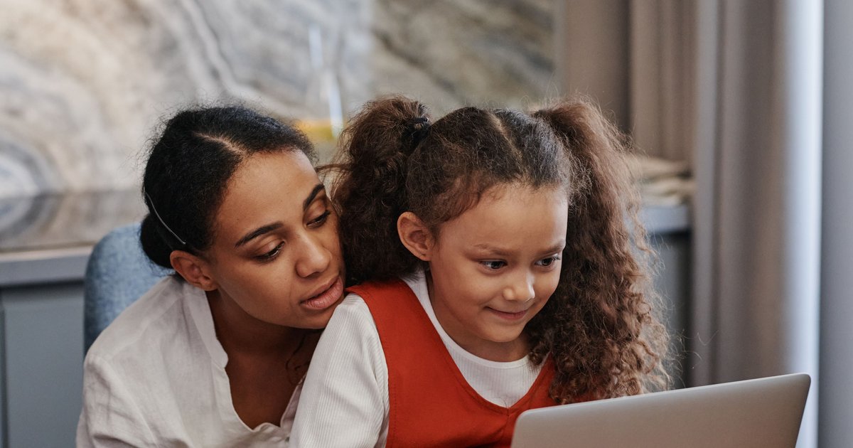 Kerala parent and CBSE student reviewing online tuition together on a laptop at home