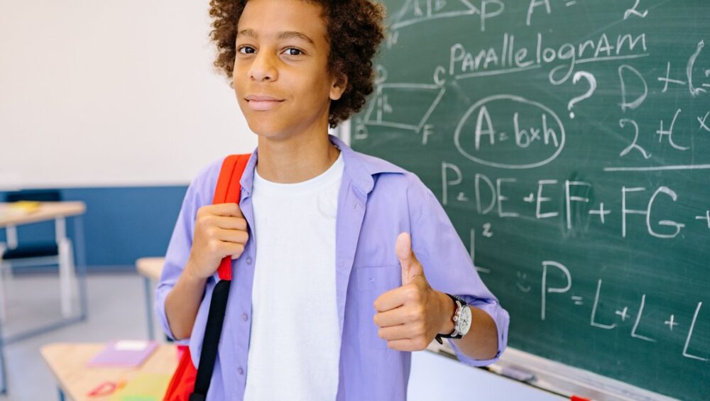 CBSE student giving a thumbs up after improving maths scores through online coaching