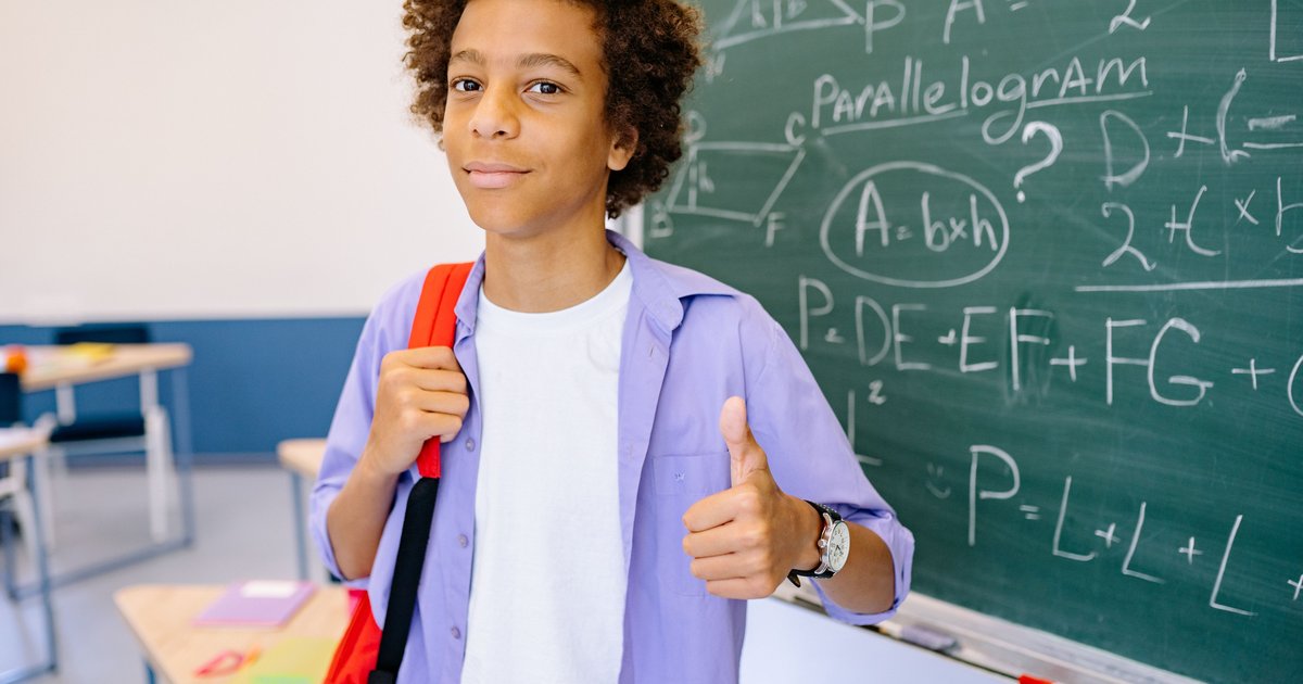 CBSE student giving a thumbs up after improving maths scores through online coaching