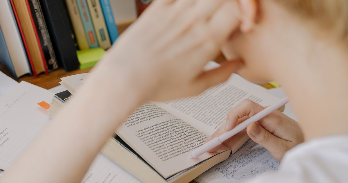CBSE student writing in a notebook as part of online English tuition