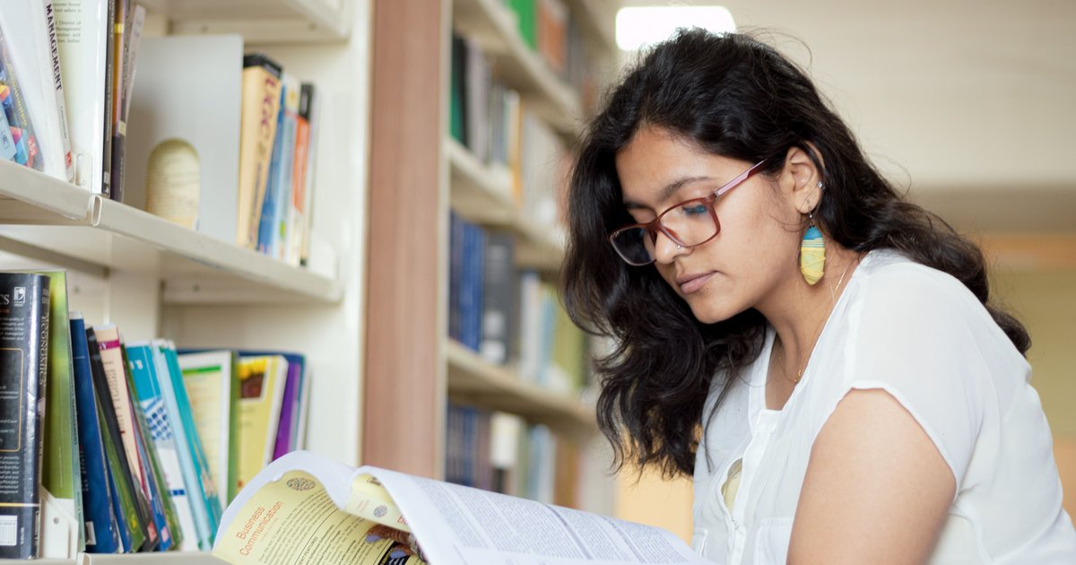 CBSE student reading a Hindi textbook as part of online Hindi tuition