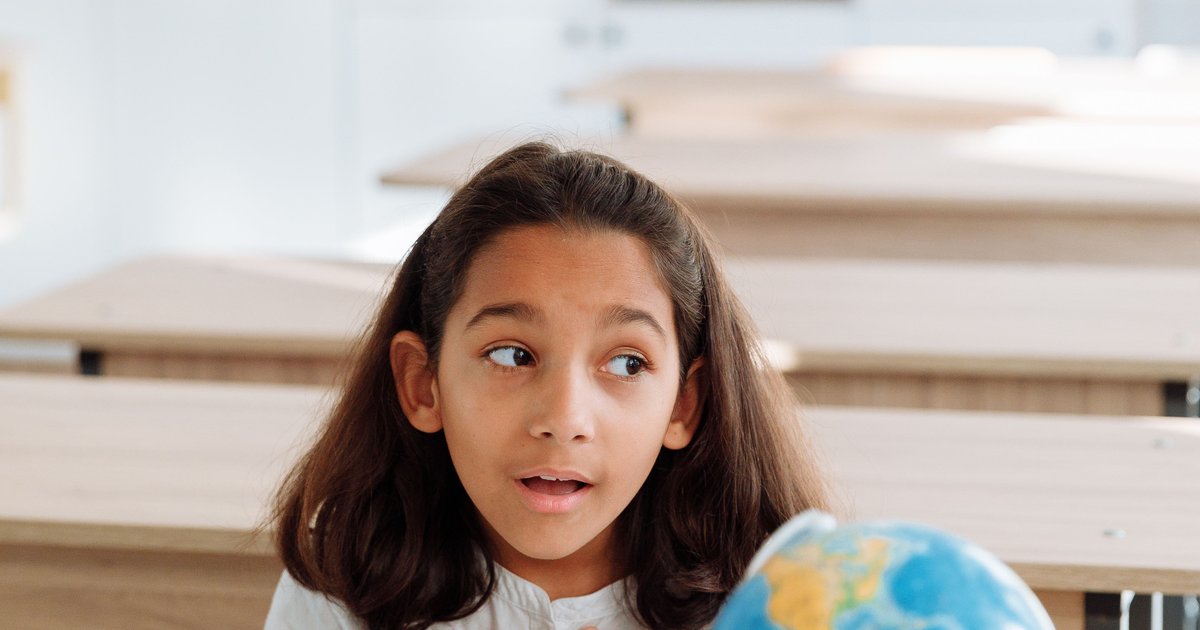 CBSE student studying geography with a globe as part of online social science tuition