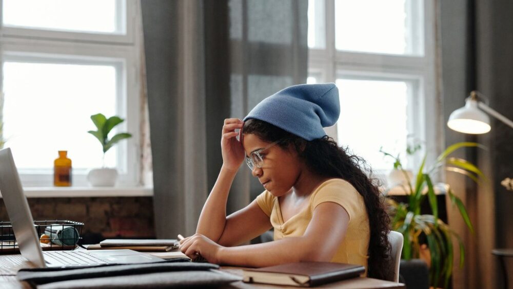 CBSE student studying at a home desk comparing online tuition to offline tuition centres