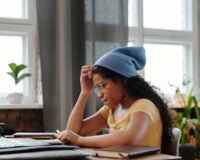 CBSE student studying at a home desk comparing online tuition to offline tuition centres