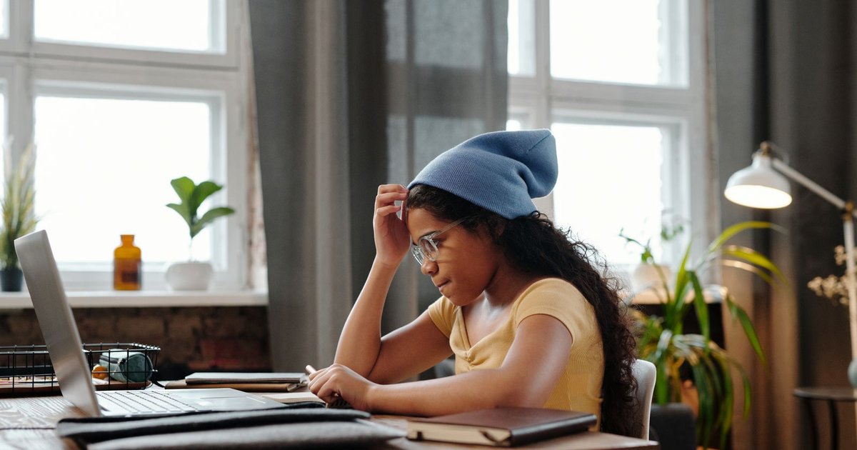 CBSE student studying at a home desk comparing online tuition to offline tuition centres