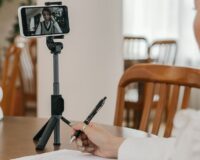 Student comparing online tuition apps on a smartphone at home